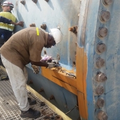 Injection of stratathane into the horizontal leaking flange of the Ahafo Ball Mill.