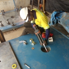 INSTALLING A JACKING SCREW UNDER THE BASE OF A MOTOR BASE PLATE