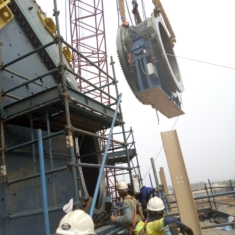 INSTALLING THE DISCHARGE END TRUNNION WITH THE TRUNNION BEARING AT NEWMONT AHAFO LINE 2